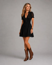 Elegant smocked lace trim black mini dress